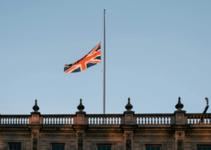 A union jack is seen flying at half mast above Buckingham Palace in London, in memory of our beloved late Queen.