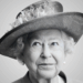 The late and great Queen Elizabeth II is seen, captured in greyscale photography.