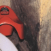 The corner of a child's bedroom is seen, with a Lightning McQueen toddler's chair being steadily engulfed by black mould.