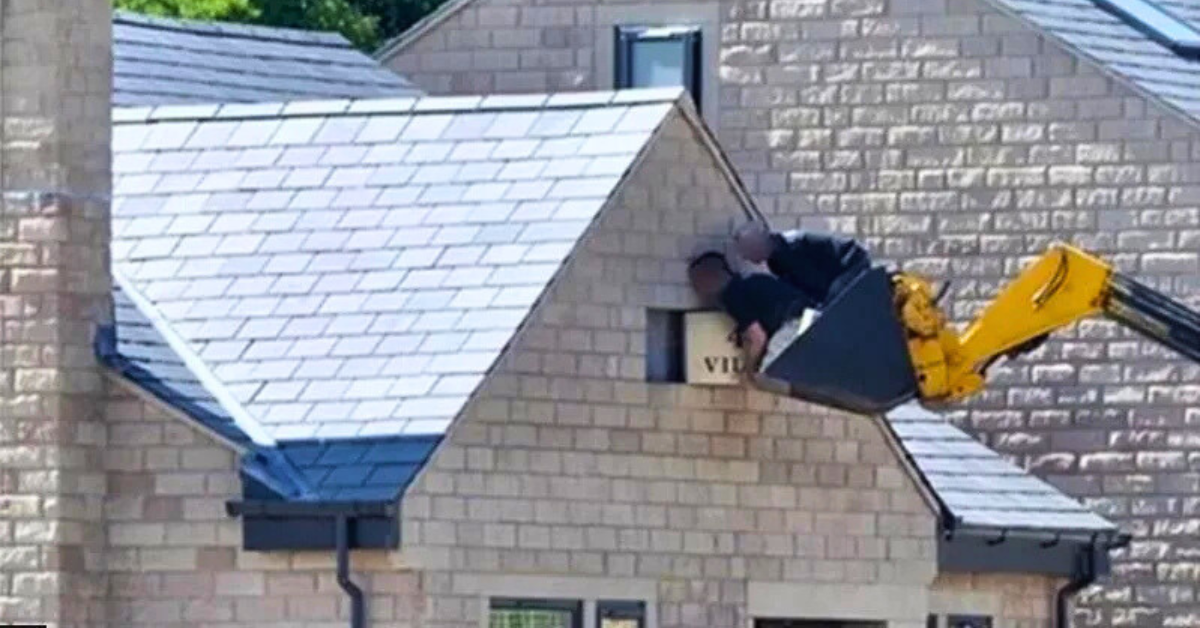 Firm fined £120K after builders hang out of digger’s bucket