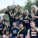 A team of jovial colleagues at Pabla and Pabla Solicitors are seen post-run, each of them delighted to be raising money for Francis House Childrens Hospice.