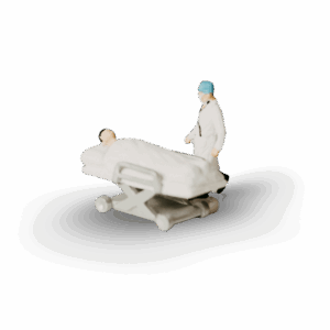 A miniature diorama of a doctor and patient are seen side by side, presumably on the verge of committing a miniature case of medical negligence.